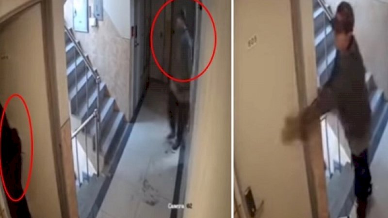 Penguntit berusaha membuka pintu.