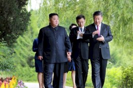 Kim Jong Un dan Xi Jinping Mencapai 