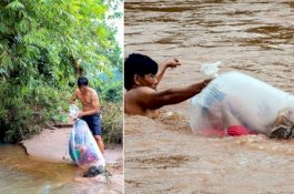 Viral, Pria Masukkan Siswa di Kantong Plastik Lalu Seberangi Sungai Berarus Deras