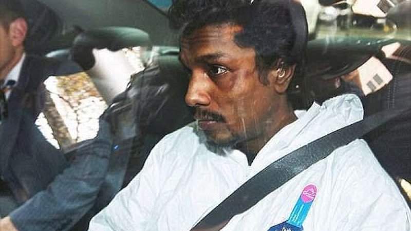 Manodh Marks saat dibawa ke kantor polisi.