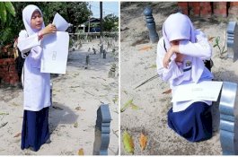 Sambil Menangis Gadis 12 Tahun Ini Bacakan Hasil Ujiannya di Depan Makam Ibu