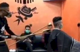 Takut Virus Corona, Tukang Cukur di China Potong Rambut Menggunakan Tongkat