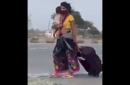 Sambil Gendong Anak dan Tenteng Koper, Perempuan Ini Berjalan Kaki 1.200 Kilometer yang Bikin Geram