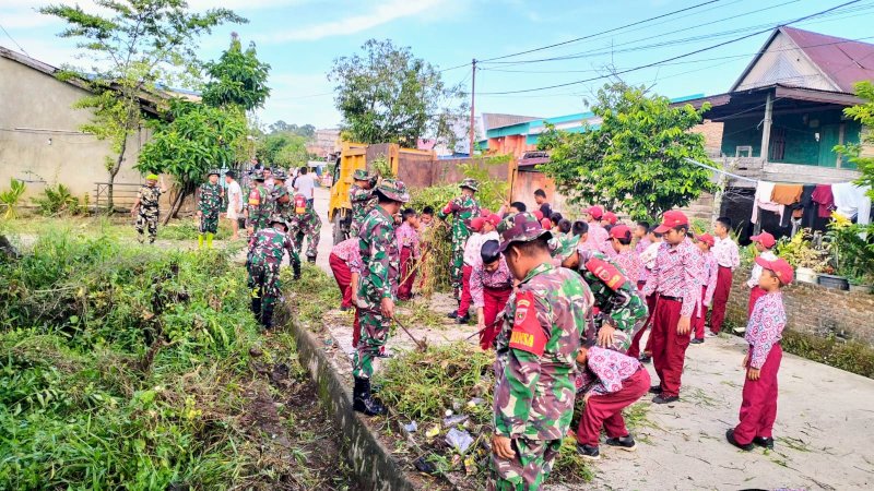 Koramil 1406-10/Pitimpanua Peduli Lingkungan: Karya Bakti Pencegahan Banjir di Siwa