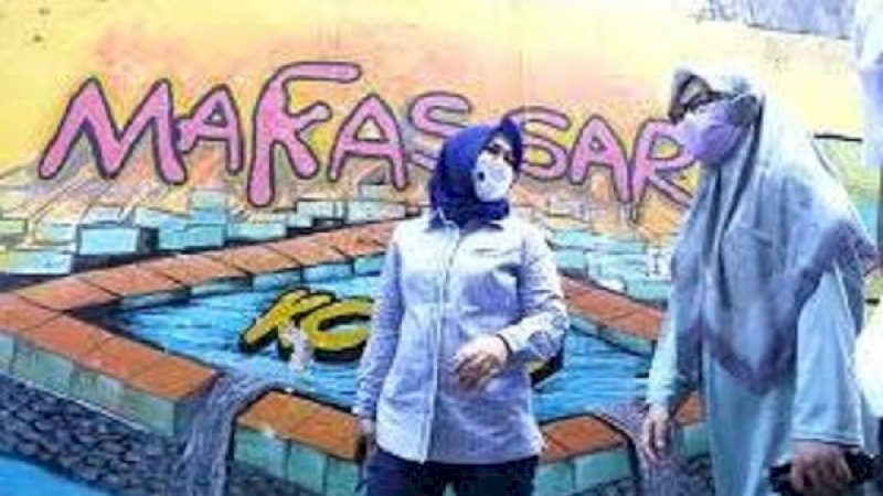 Salah satu potret sudut lorong di Kota Makassar yang dihiasi dengan grafiti.